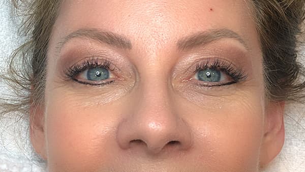 A image of woman's eyes after permanent eyebrows
