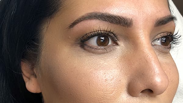Image of a lady's eyes after permanent eyebrows