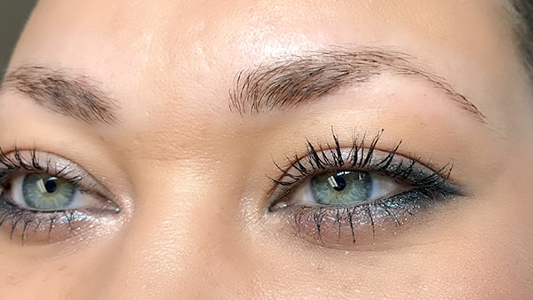 Image of eyes before using eyeliner and permanent eyebrows
