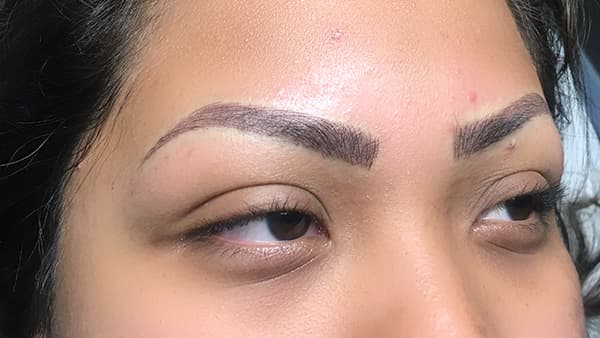 Image of girl's eyes after permanent eyebrows