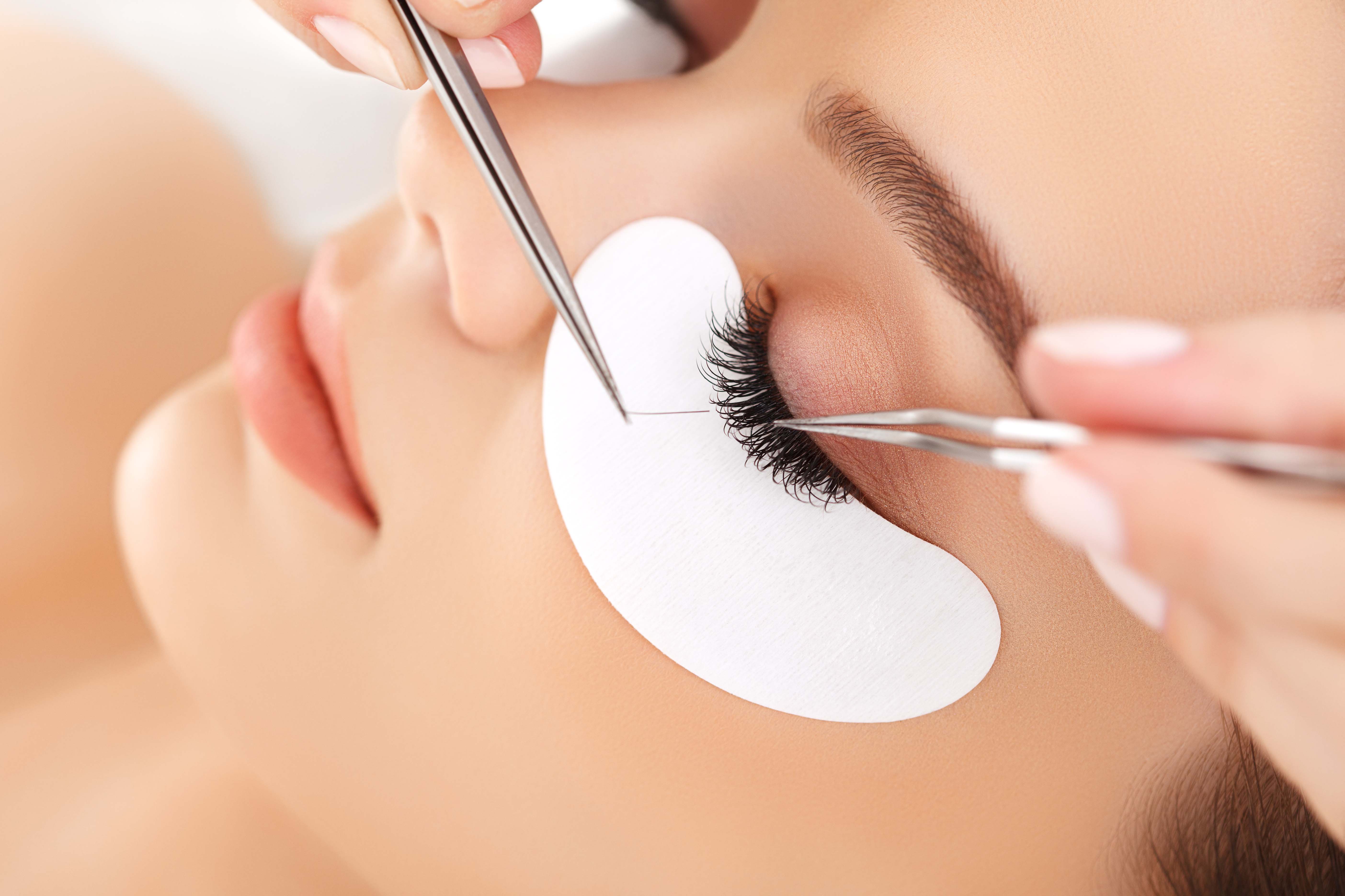 Woman with long eyelash extensions